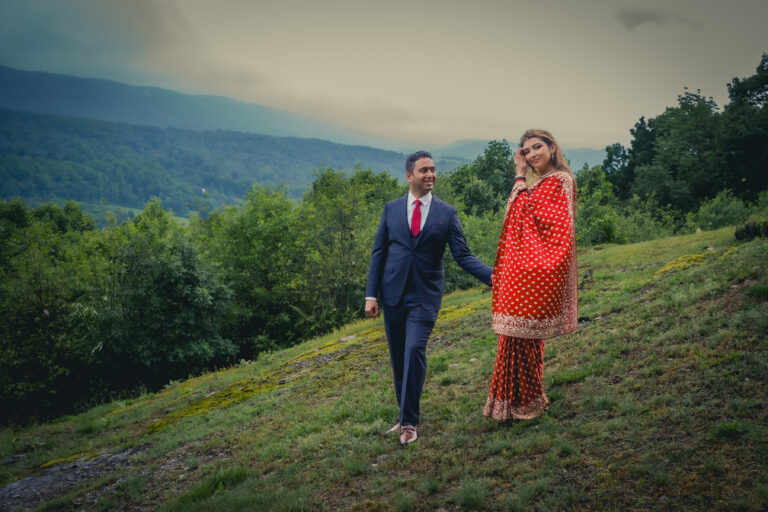 Groom and bride hold hands on Ridgecrest hillside