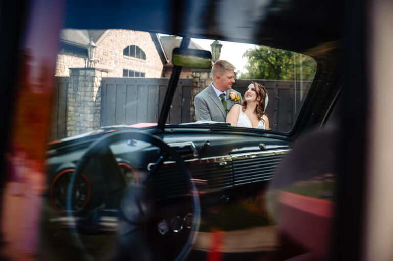 Couple embraces outside truck window