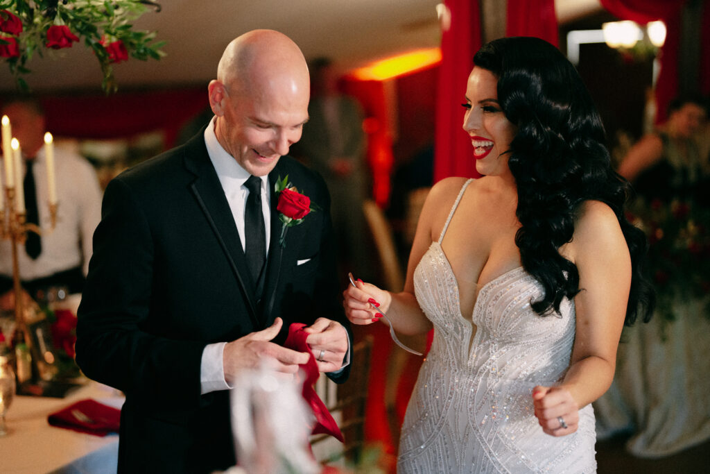 Bride and groom share wedding cake